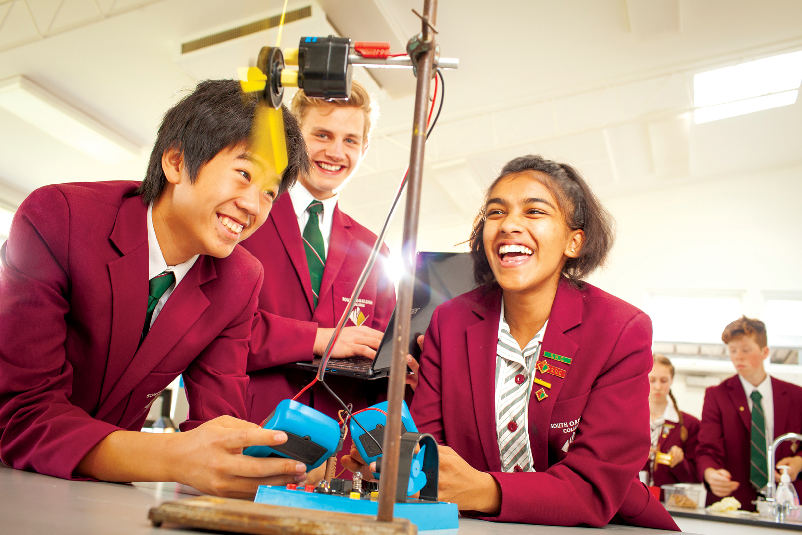 Three Student With Wind Turbine