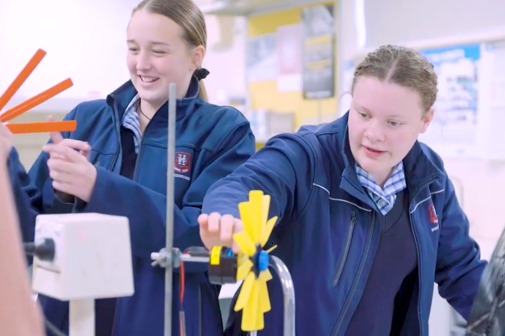 Two Female Students And Turbine Blades